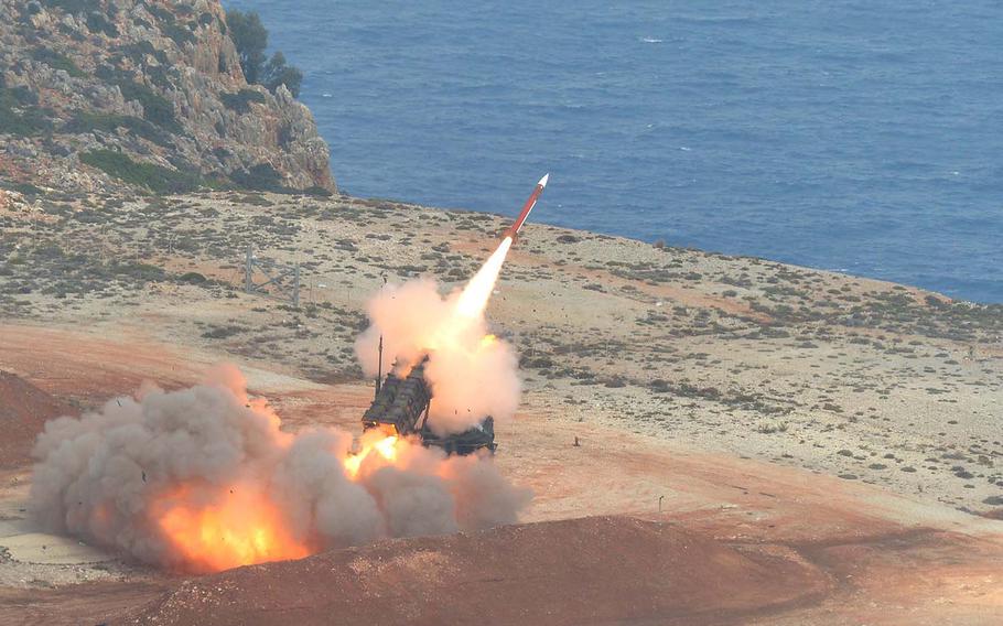 A Patriot missile bursts out of its launcher at the NATO air missile firing installation outside Chania, Crete, Thursday, Oct. 1, 2015. The U.S. wants to increase military drills and rotate more troops through bases in Greece.