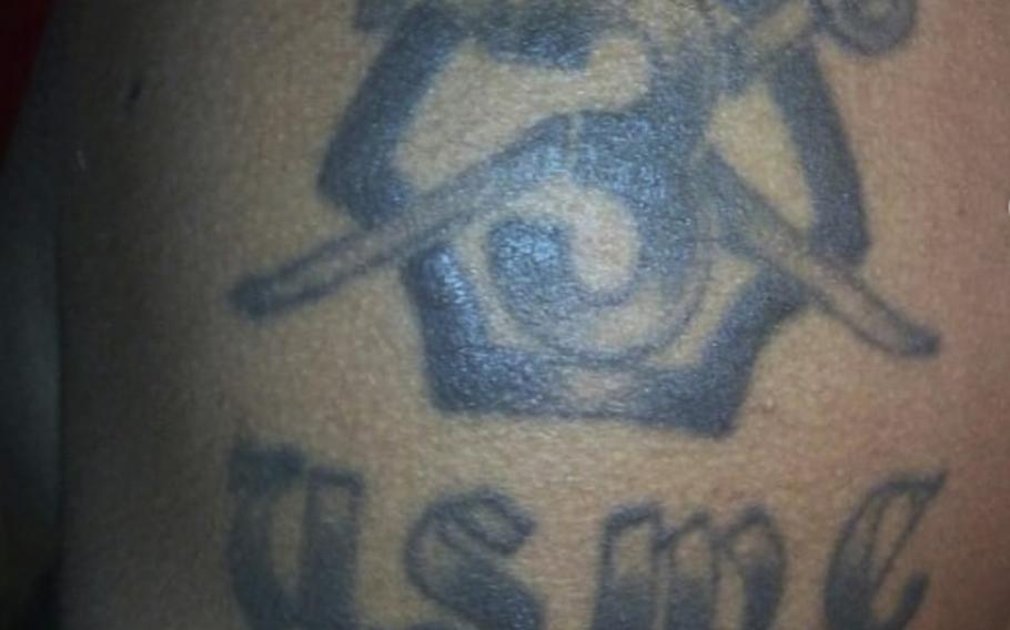 Ewart Odane Bent shows off his Marine Corps tattoo in this image shared to his Instagram account.