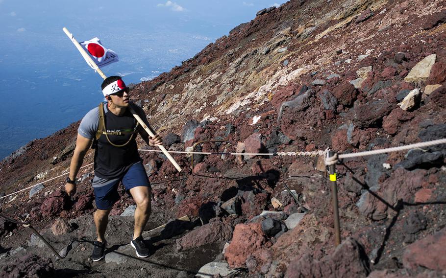 Marine Corps Staff Sgt. Camilo Gomez, an administrative chief with Marine Wing Support Squadron 171, climbs Mount Fuji, Aug. 2, 2018.