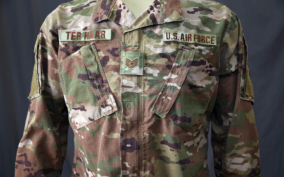 The Operational Camouflage Pattern uniform has a "hook and loop" rank displayed in the middle of the chest.