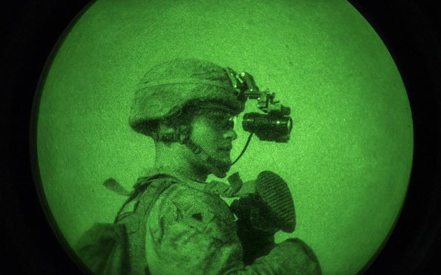 U.S. Marine Corps Cpl. Benjamin Harris looks through his night ocular device during a night patrol on July 26, 2018. New thermal-imaging developed by the Army Research Laboratory might help servicemembers see better in complete darkness.
