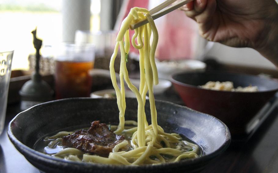 Grilled pork simmers in Owkinawan soba at Hanakinah Okinawa Soba. 