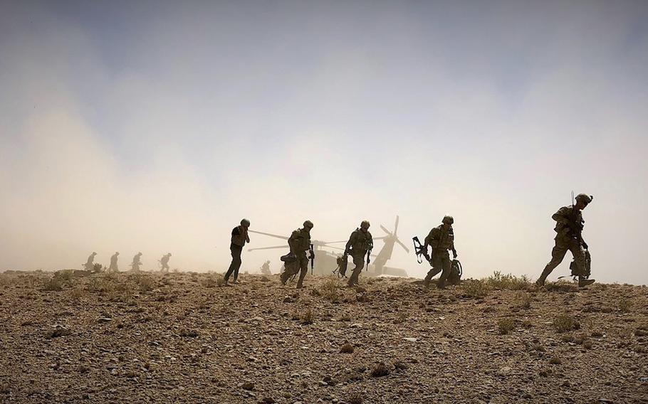 Soldiers from 2nd Squadron, 1st Calvary Regiment, 1st Stryker Brigade Combat Team, 4th Infantry Division dismount a UH-60 Blackhawk in preparation for a foot patrol in Afghanistan, Sept. 4, 2018.