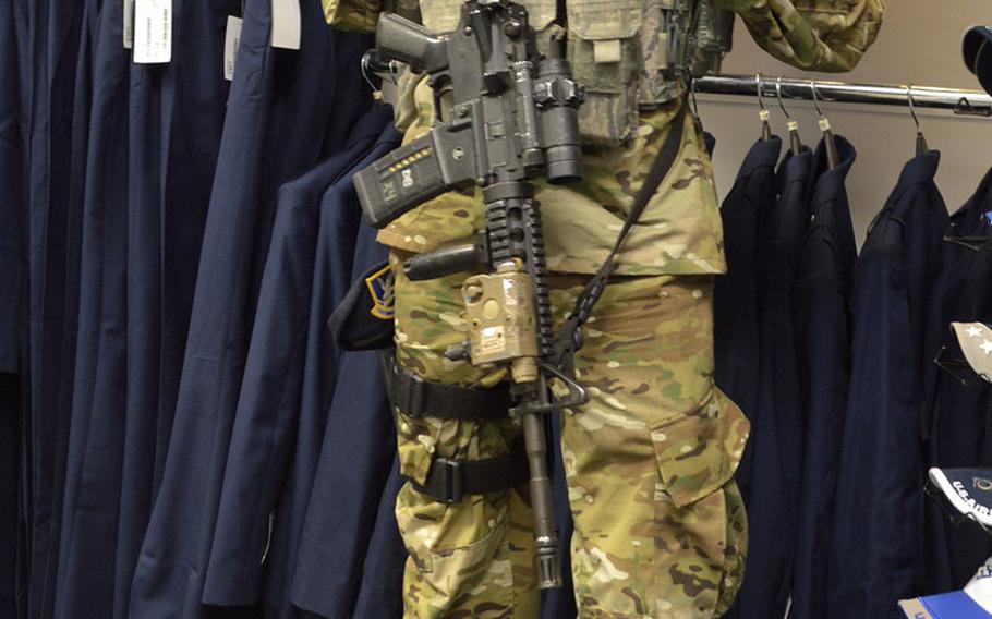 Airman 1st Class Brandon Shank, a Security Forces airman with the 31st Security Forces Squadron, 31st Fighter Wing, Aviano Air Base, Italy, provides security at the Base exchange clothing shop, Monday, Oct. 1, 2018. Aviano is one of the first Air Force bases to begin selling the new Operational Camouflage Pattern uniform.