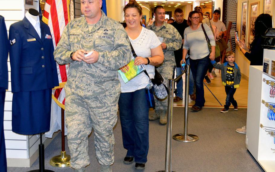 Airmen at Aviano Air Base enter the military clothing shop after waiting in line for more than an hour to purchase their new Operational Camouflage Pattern uniforms, Monday, Oct. 1, 2018. Aviano is one of the first Air Force bases to begin selling the new OCP uniform.