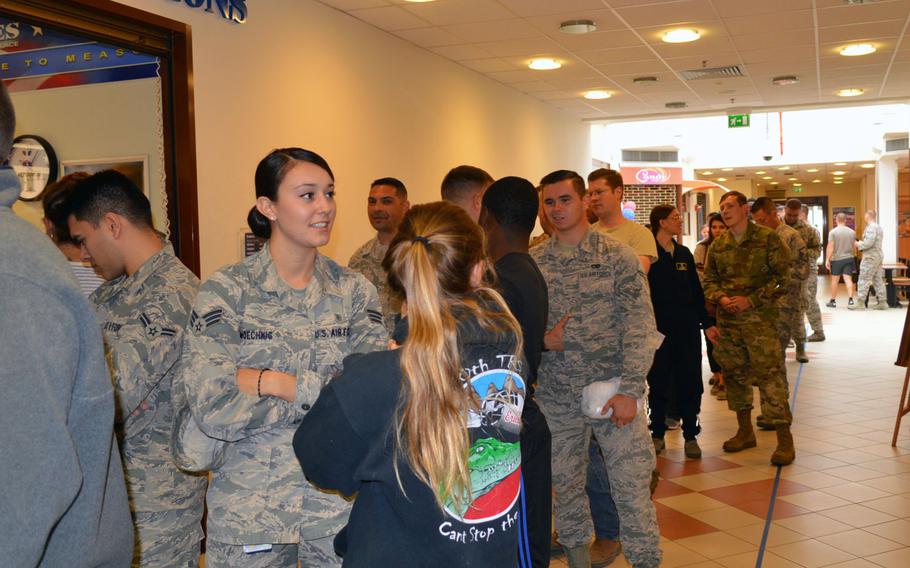 Airmen at Aviano Air Base, Italy, wait for the exchange's military clothing shop to open so they can purchase their new Operational Camouflage Pattern uniforms, Monday, Oct. 1, 2018.