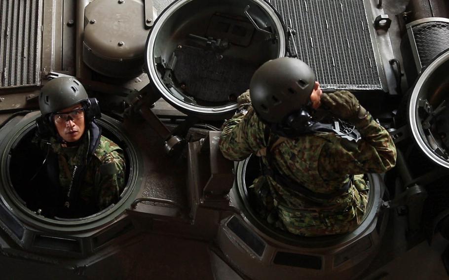 Japanese troops embark aboard the USS Ashland in an amphibious-assault vehicle during Kamandag drills in Subic Bay, Philippines, Oct. 3, 2018.
