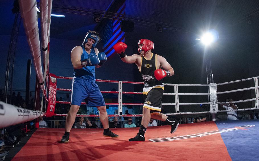 Sloan Grey, right, of Stuttgart follows through after landing a right hook against Brenden Chernis of Baumholder during their super heavyweight bout at the Oktoberfest Boxing Championships in Stuttgart. Grey won the Saturday night fight.