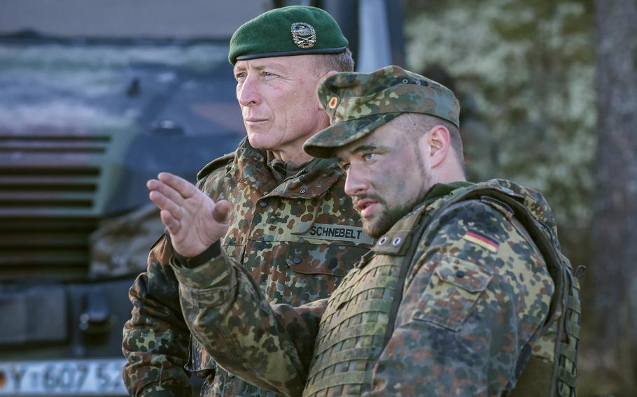 Two German soldiers coordinate just before a river crossing in drills leading up to exercise Trident Juncture, Oct. 22, 2018.