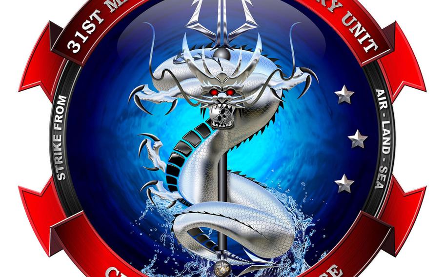 The Okinawa-based 31st Marine Expeditionary Unit's new insignia features a fearsome East Asian sea dragon bursting from the ocean while wrapped around a trident.