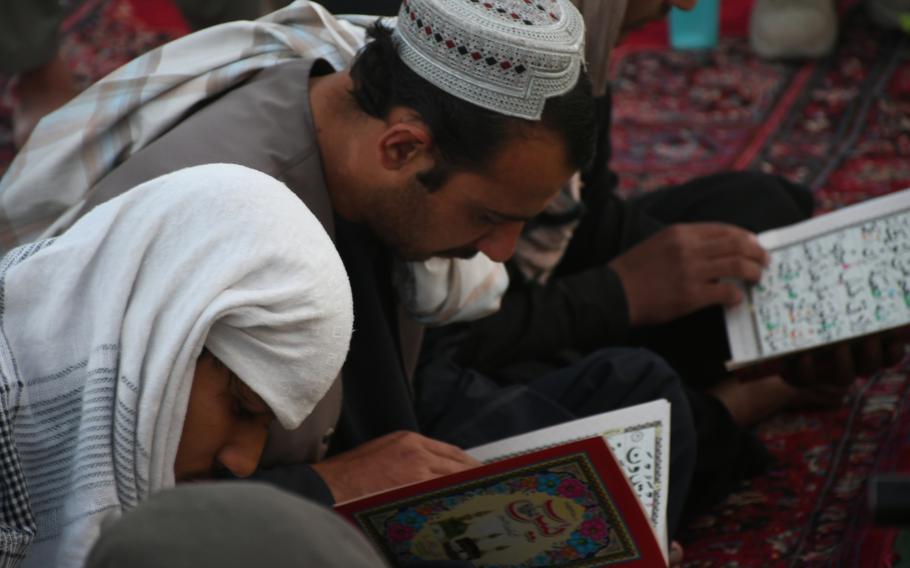 Kandaharis mourn at the grave of former Kandahar police chief Gen. Abdul Raziq on Thursday, Oct. 25, 2018.