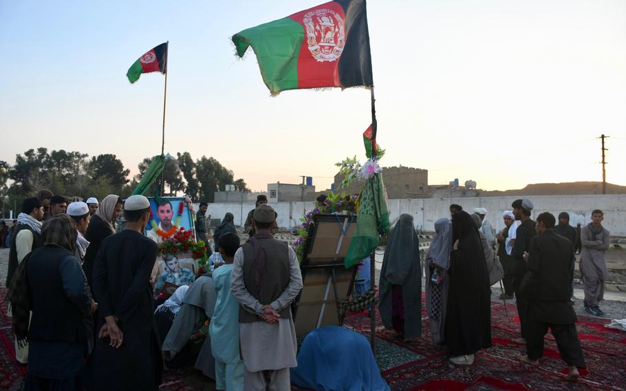 Mourners visit the grave of former Kandahar police chief Gen. Abdul Raziq on Thursday, Oct. 25, 2018, one week after Raziq was assassinated in an attack claimed by the Taliban.