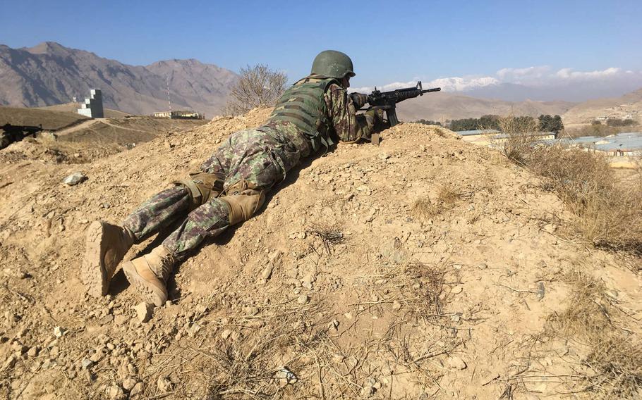 An Afghan soldier takes part in commando training in Kabul on Nov. 26, 2017. Plans are underway to double the country's commando force in a bid to reverse recent gains by Taliban insurgents.