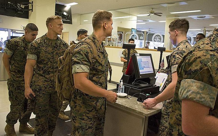 Marines check in to dine at the 12th Marines Mess Hall at Camp Hansen, Okinawa, Oct. 12, 2018.