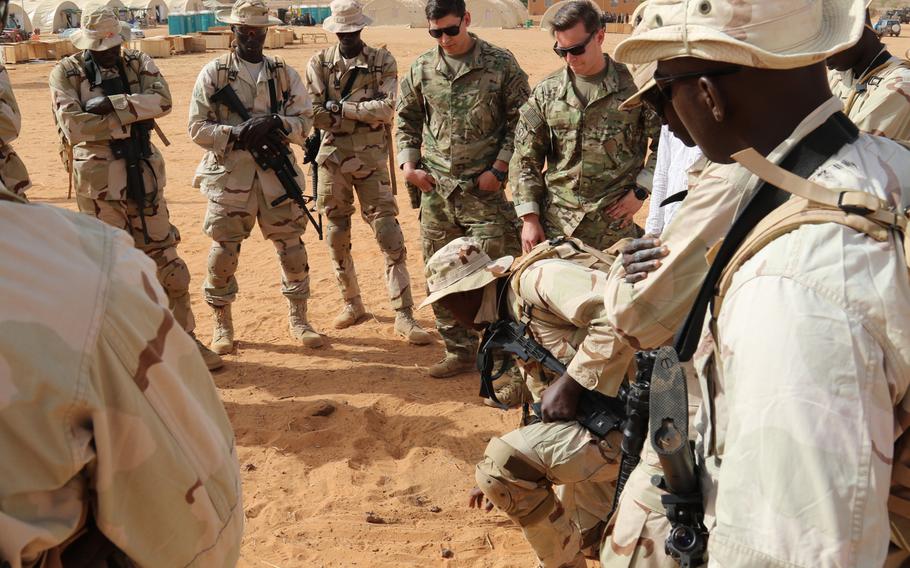 A Senegalese squad leader uses rocks to explain movement techniques during the Flintlock 18 exercise on April 12, 2018, in Tahoua, Niger. Islamic militant attacks rose slightly during the past year in Africa, according to the Africa Center for Strategic Studies.