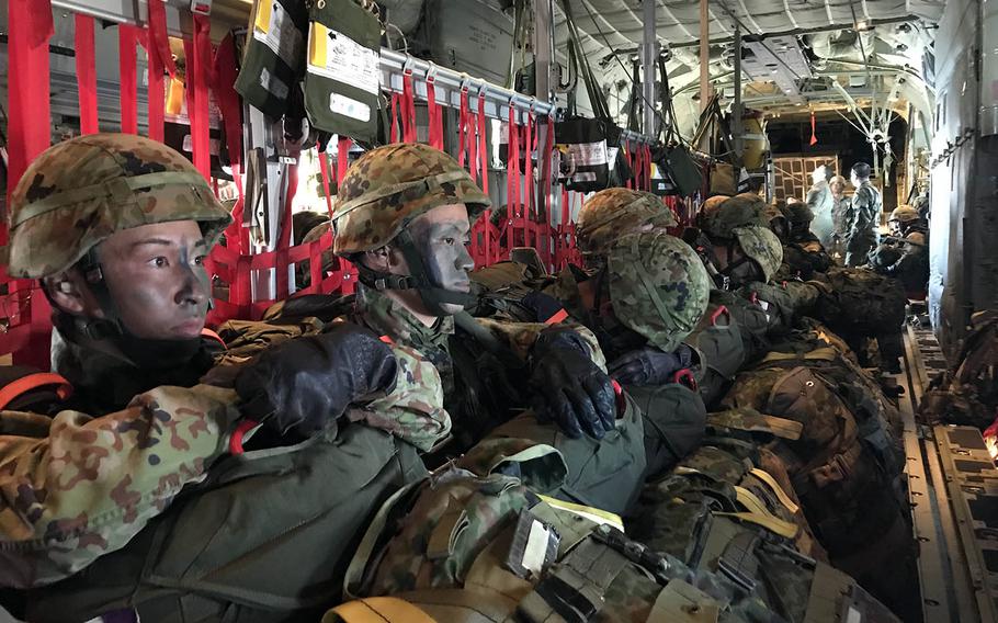 Japanese paratroopers ride in a C-130J Super Hercules assigned to the 374th Airlift Wing at Yokota Air Base, Japan, during the Keen Sword exercise, Sunday, Nov. 4, 2018.