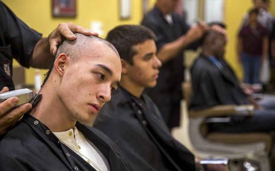 New recruits receive their initial haircut during receiving at Marine Corps Recruit Depot San Diego, Oct. 29, 2018.