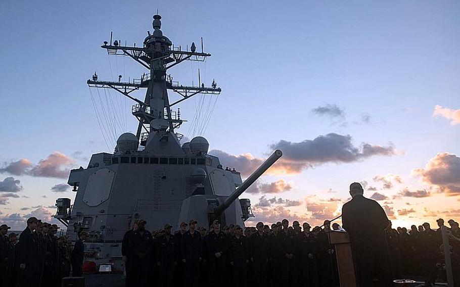 Cmdr. Leonard Leos addresses the crew of USS Stockdale after assuming command of the Arleigh Burke-class guided-missile destroyer Nov. 1, 2018, in a change of command ceremony held during routine operations in the Pacific Ocean.
