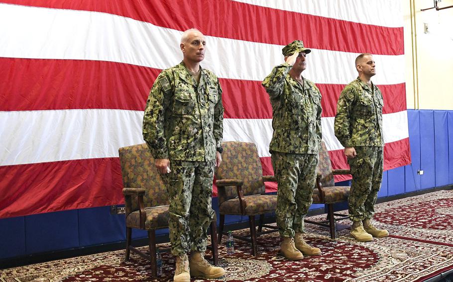 Vice Chief of Naval Operations Adm. Bill Moran, center, salutes as taps is played during a memorial service honoring Vice Adm. Scott Stearney on Naval Support Activity Bahrain, Wednesday, Dec. 5, 2018. Stearney, who led U.S. Naval Forces Central Command and the 5th Fleet, was found dead at his Bahrain home Dec. 1.