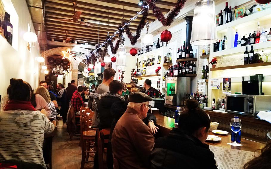 The interior of at La Taperia de Columela, crowded with locals, in Cadiz, Spain.
