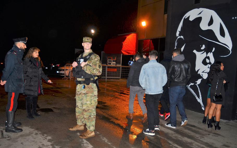 Italian Carabinieri and military police conduct a random visit at a Vicenza night spot in November. The patrols, started in response to incidents downtown, are scheduled to last for several months.
