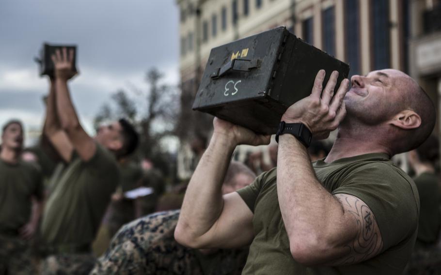 Marines with Marine Forces Reserve perform ammunition can lifts during the combat fitness test at Marine Corps Support Facility New Orleans, Dec. 14, 2018.