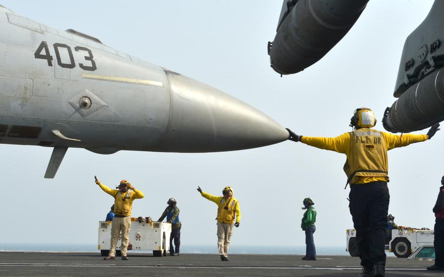 Flight deck personnel launch and recover aircraft aboard the USS John C. Stennis on Jan. 9, 2019.