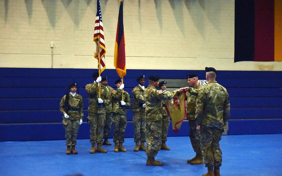 The leaders of the 589th Brigade Support Battalion unfurl the newly activated brigade's colors, during a ceremony at Grafenwoehr, Germany, Jan. 11, 2019.