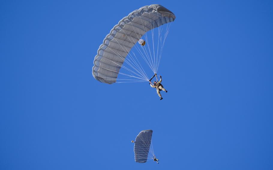 Paratroopers take part in a drill at Narashino Training Area in Chiba prefecture, Japan, Sunday, Jan. 13, 2019.