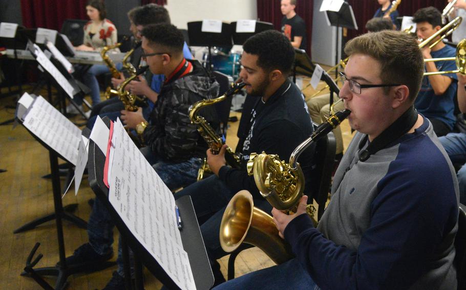 Baritone saxophonist Kevin Predmore of Kaiserslautern High School and the rest of the saxophone section practice a number at this year's DODEA-Europe jazz seminar in Kaiserslautern, Germany.