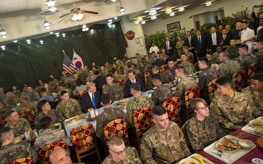 President Donald Trump speaks with South Korean President Moon Jae-in and troops from both nations over lunch at Camp Humphreys, South Korea, Tuesday, Nov. 7, 2017.