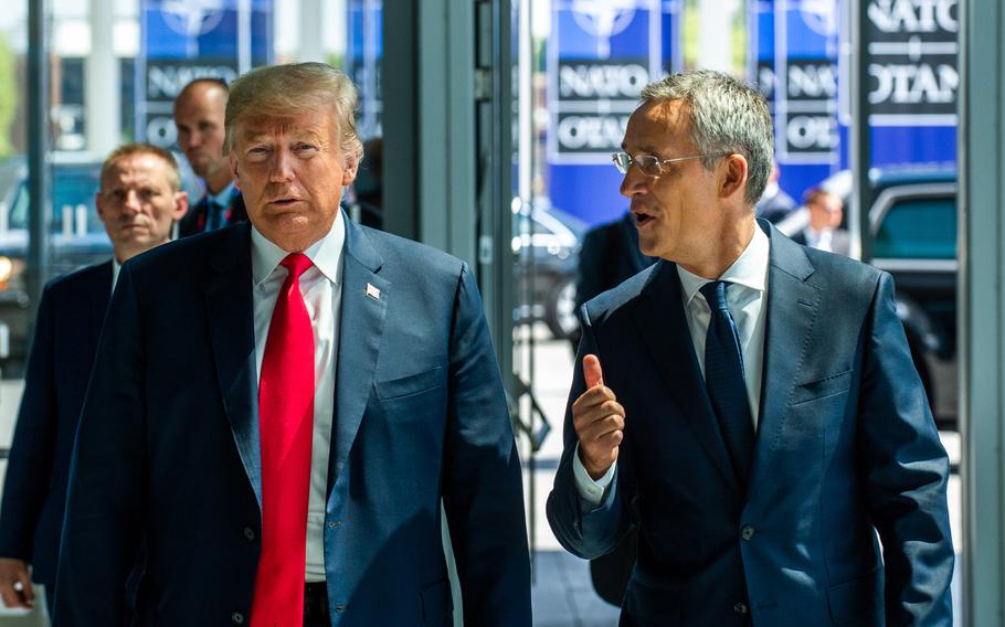 President Donald Trump walks with NATO Secretary-General Jens Stoltenberg at the opening of the NATO summit at the organization's headquarters in Brussels in July 2018.