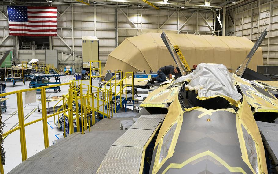 A 574th Aircraft Maintenance Sqaudron maintainer performs depot maintenance on an F-22 fighter jet at Hill Air Force Base, Utah, Jan. 16, 2018. The 574th installed the first metallic 3D printed part on an operational F-22 in December.