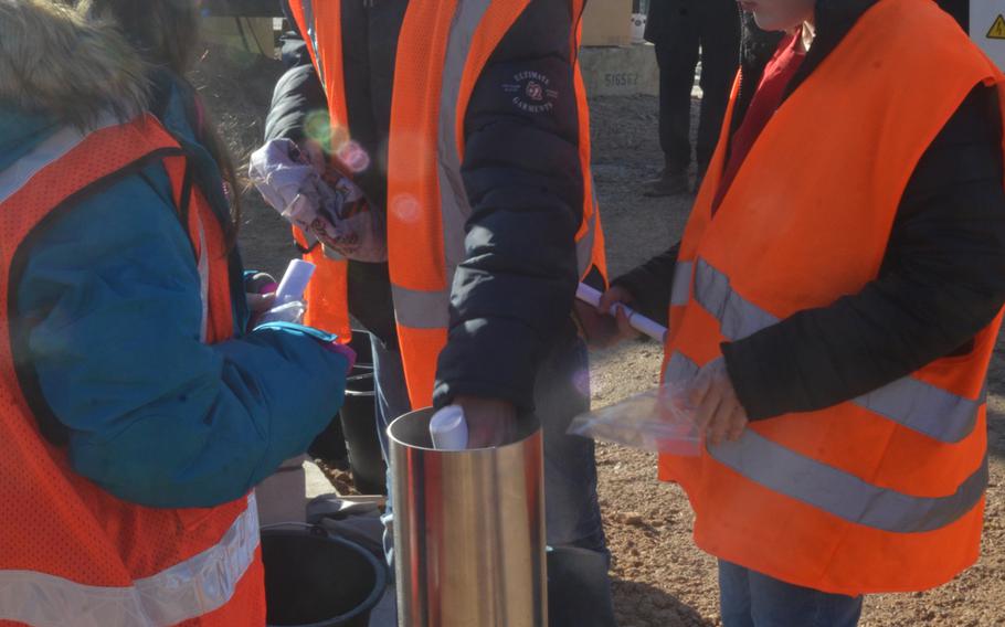 Students attending the current Wiesbaden Elementary School prepare a time capsule to be buried at the site of a new school in Wiesbaden, Germany, on Thursday, Feb. 14, 2019.