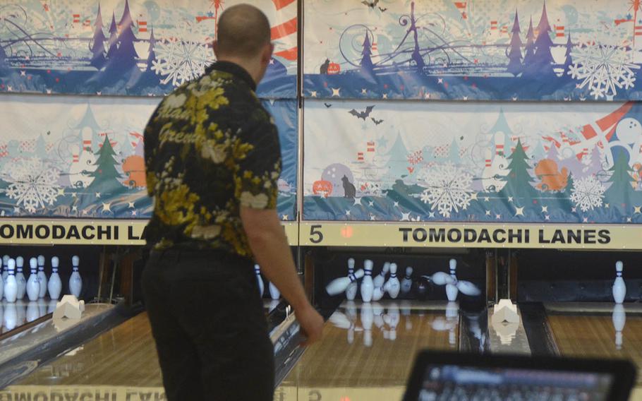 Brian Greenwood, a member of the Japan Professional Bowling Association, bowls a strike at the Yokota Air Base lanes on Feb. 6, 2019.