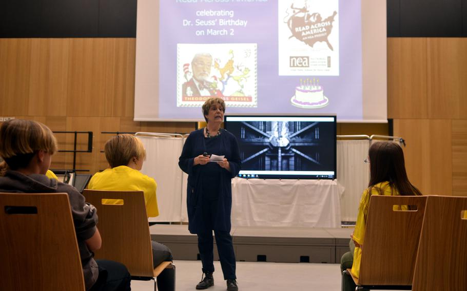 Carol Falling, the information specialist for Wiesbaden Middle School, explains to students about messages of equality that Dr. Seuss was trying to communicate with his book, at Wiesbaden Middle School, on Friday, March 1, 2019.