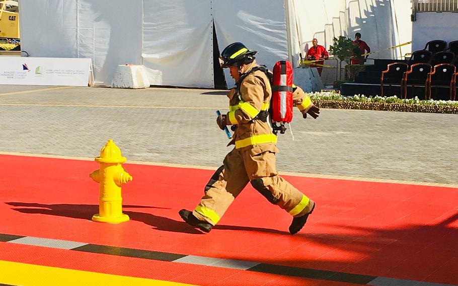 A firefighter with Naval Support Activity Bahrain Fire Department runs in the relay during the Bahrain Firefighter Challenge on Saturday, March 2, 2019.