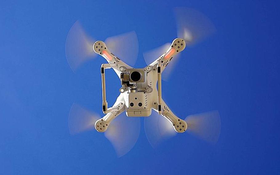 People caught flying drones over or near U.S. military bases in Japan could face up to a year in prison and fines as much as $4,472 under a planned law change.