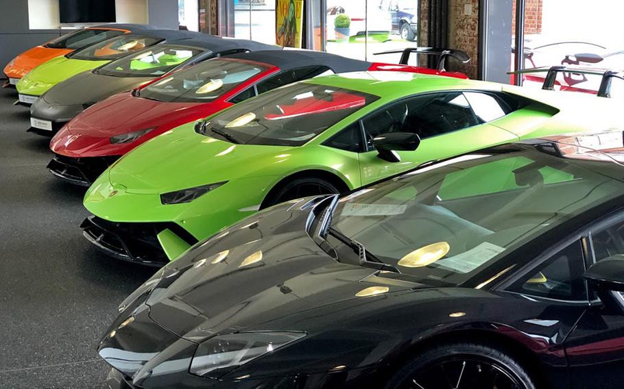 A row of Lamborghinis line the showroom floor at Klassikstadt in Frankfurt, Germany.