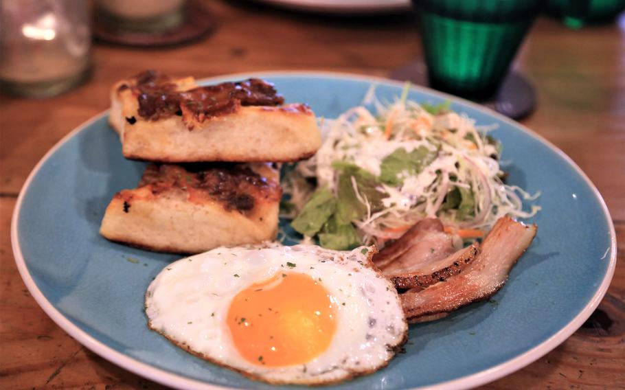 La Polleria Pipeline's morning set is served with a sunny side up egg, bacon, salad, soup, a basic drink and a choice of sweet or savory bread made by Cactus Eatrip.
