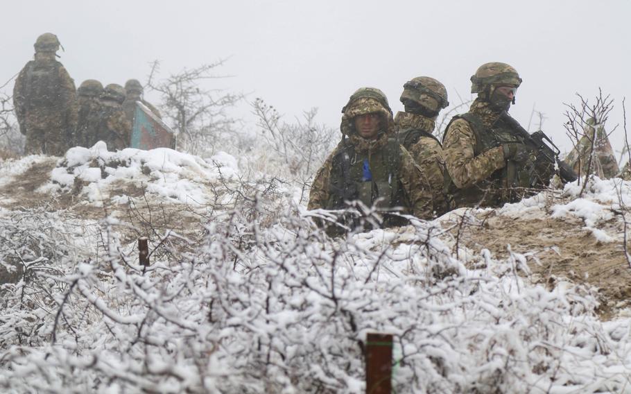Georgian army soldiers stand watch in the middle of a snow fall during a combat exercise at Norio Training Area, Georgia, Nov. 15, 2018.