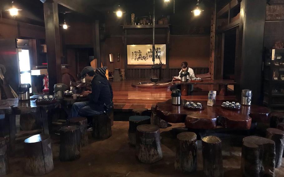 The interior of Amasake-chaya is decorated with ladders and hunting tools used in the Edo Period.