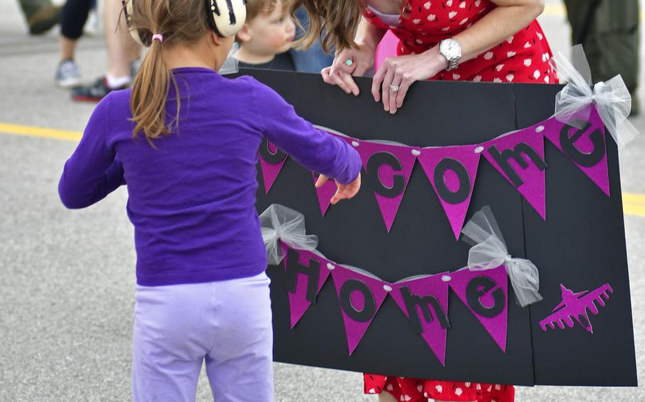 Family members await for the arrival of their loved ones at Aviano's airfield, on Tuesday, April 30, 2019. This redeployment only included a portion of the Buzzard team. The rest of the deployed 510 FS members will be returning from Afghanistan to Aviano in the upcoming weeks.