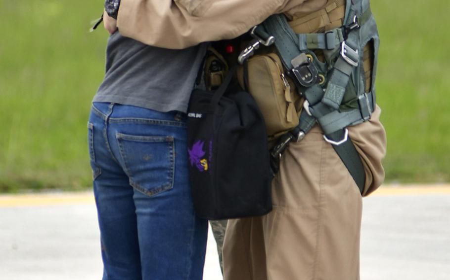 Lt. Col. Benjamin Freeborn, forward deployed commander of the 510th Fighter Squadron, "Buzzards," 31st Fighter Wing, Aviano Air Base, Italy, hugs and kisses his son during the redeployment of the squadron at Aviano's airfield, April 30.