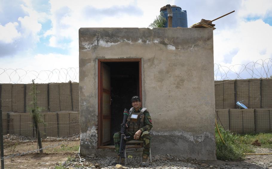 An Afghan soldier guards a remote outpost in Helmand province, the deadliest province in the country for Taliban attacks in 2018.
