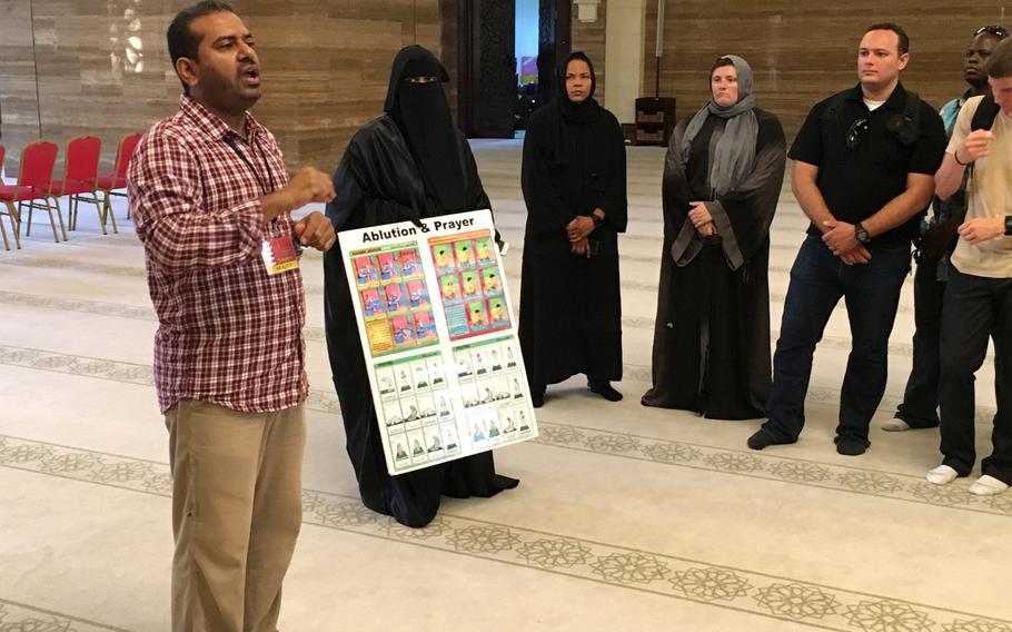 A guide answers questions for servicemembers at the Al-Fateh Mosque in Bahrain during a base indoctrination tour in August 2018. Ramadan, the Muslim holy month, is set to begin May 6 and requires all expats in Bahrain to observe fasting laws during daylight hours.