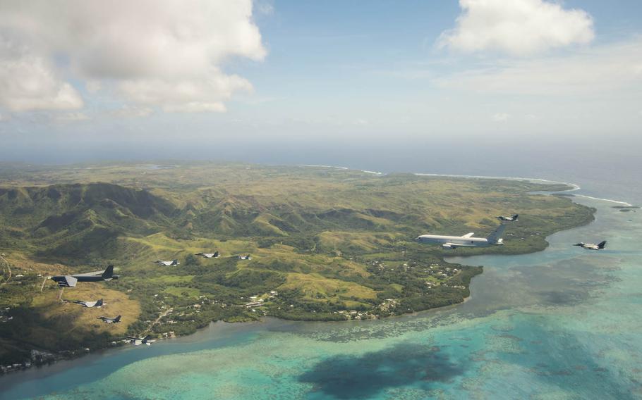 Aircraft from the United States, Australia and Japan fly together off the coast of Guam, March 6, 2019.