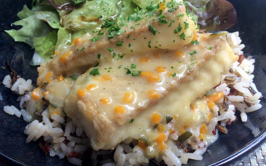 Bayeux, along with the rest of Normandy, is a great place to try French cuisine, especially fish and seafood. At l'Alchimie on Rue Saint Jean they served this pollock served in an orange sauce on rice.
