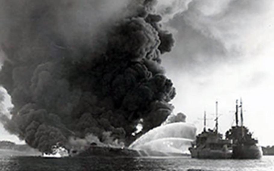 A U.S. Coast Guard photographer captured the aftermath of the catastrophic explosion at West Loch in Pearl Harbor, Hawaii, on May 21, 1944.