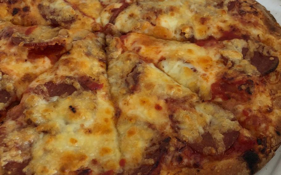 Mr. Pizza's pizza is not the prettiest thing in the region, but it tastes good. The look of the pizza matched the look of everything else I was served during the meal.